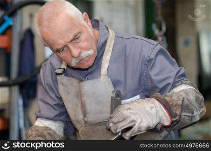 senior metal worker at work