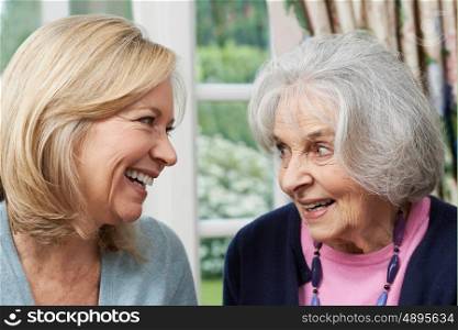 Senior Mother And Adult Daughter Talking Together
