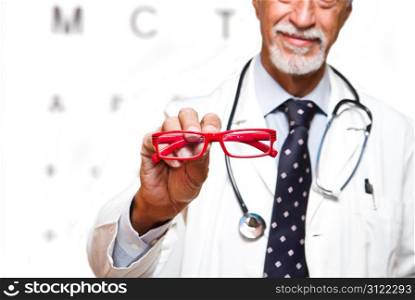senior ophthalmologist on white background