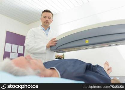 senior patient undergoing mri scan at hospital