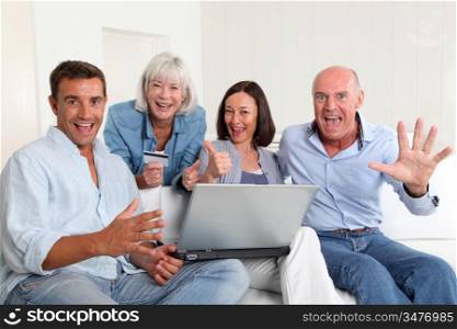 Senior people with couple doing shopping online