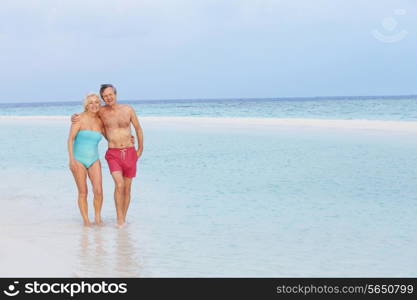 Senior Romantic Couple Walking In Beautiful Tropical Sea