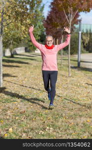 Senior runner man arms up after running