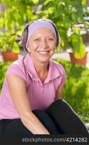 Senior sportive woman smiling outside portrait sunny day