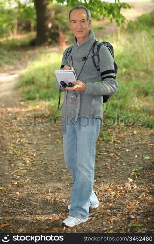 senior taking a walk in the country
