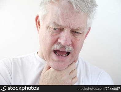 senior with a hand on his painful throat