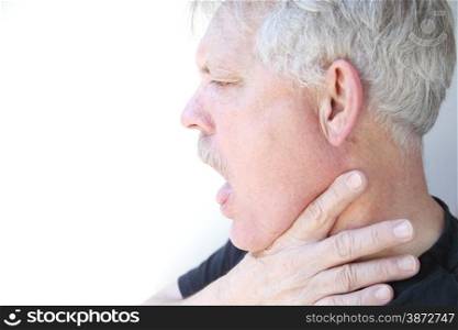 senior with mouth open and hand on jaw and neck