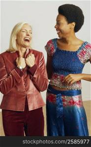 Senior woman and a young woman laughing