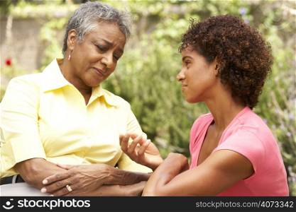 Senior Woman Being Consoled By Adult Daughter