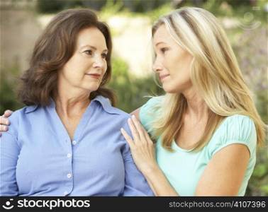 Senior Woman Being Consoled By Adult Daughter