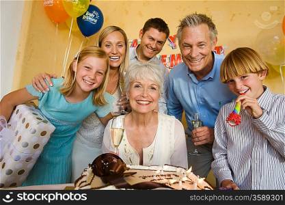 Senior woman celebrating birthday with family