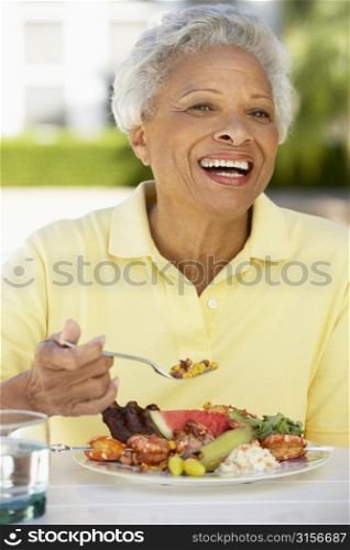 Senior Woman Dining Al Fresco