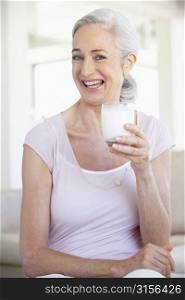 Senior Woman Drinking A Glass Of Milk