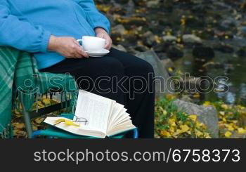 senior woman drinking coffee. Unrecognisable Person, Side View