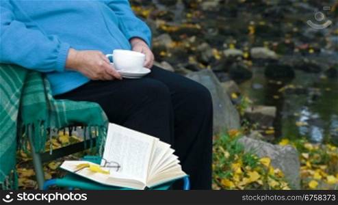senior woman drinking coffee. Unrecognisable Person, Side View