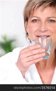 senior woman drinking water
