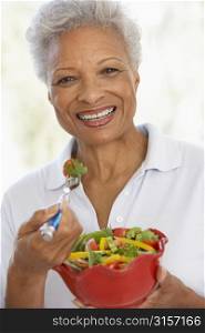 Senior Woman Eating A Fresh Green Salad