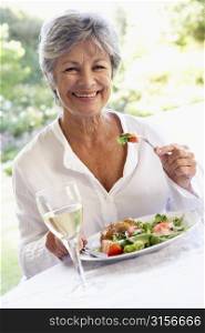 Senior Woman Eating An Al Fresco Lunch