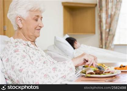 Senior Woman Eating Hospital Food