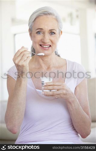 Senior Woman Eating Yogurt