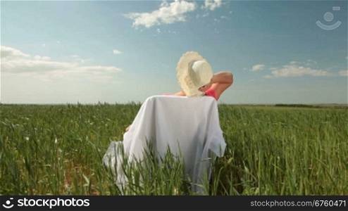 Senior woman enjoying retirement on the nature, rear view, wide shot