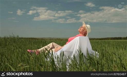 Senior woman enjoying summer holidays on the nature