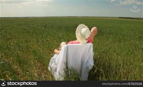 Senior woman enjoying summer holidays on the nature, wide shot
