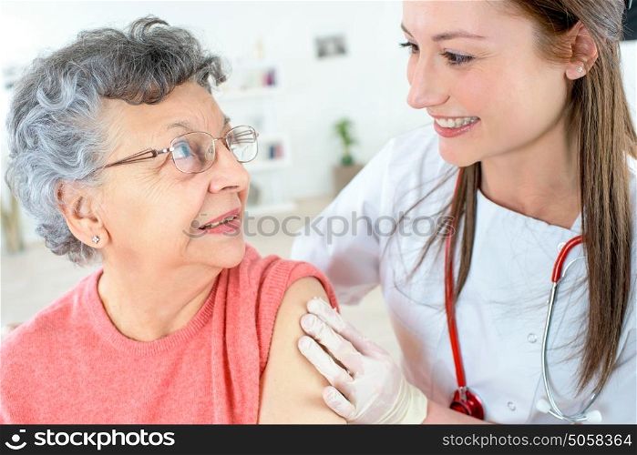 Senior woman getting a jab