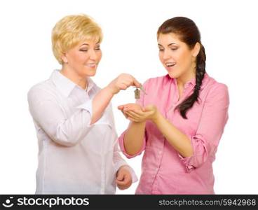 Senior woman give keys to young woman isolated