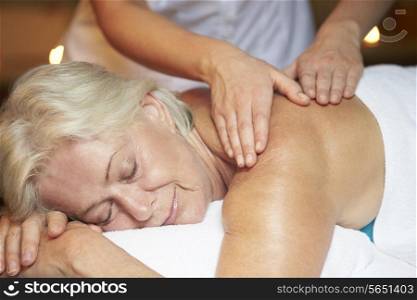 Senior Woman Having Massage In Spa