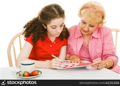 Senior woman helping her eighteen year old granddaughter register to vote for the first time. Isolated on white.