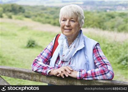 Senior Woman Hiking In Countryside