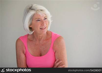 Senior woman in a pink vest