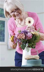 Senior Woman In Flower Arranging Class