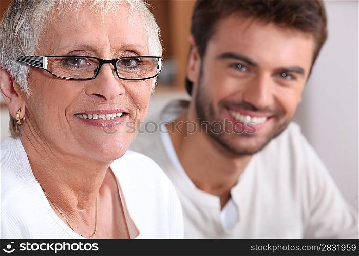 Senior woman in glasses with young man