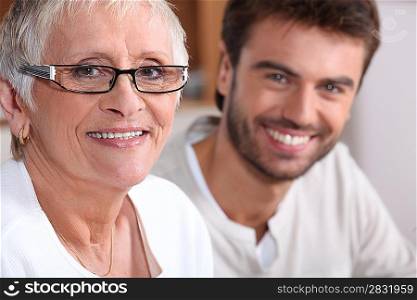 Senior woman in glasses with young man