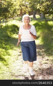 Senior Woman Jogging In Park