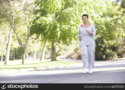 Senior Woman Jogging In Park