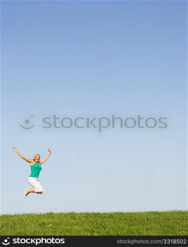 Senior woman jumping in air