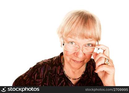 Senior woman looking over her glasses