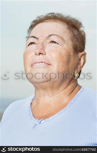 Senior woman looking up