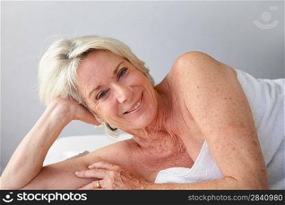 senior woman lying in bed