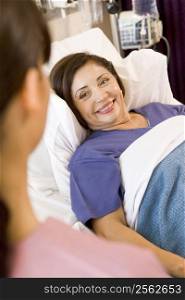 Senior Woman Lying In Hospital Bed,Smiling