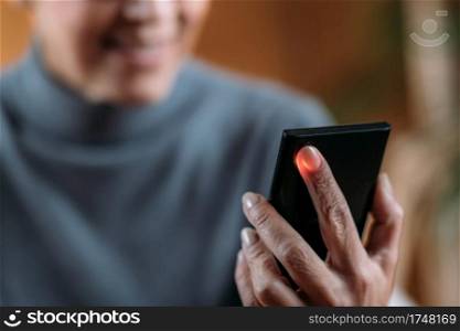 Senior Woman Measuring Pulse or Heart Rate with Smart Phone