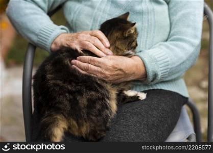 senior woman nursing home holding cat