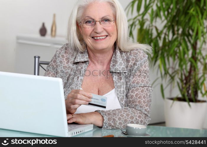 Senior woman paying online