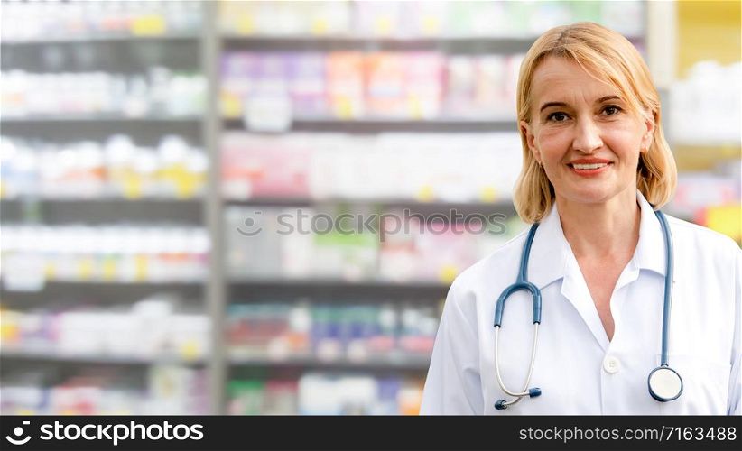 Senior woman pharmacist working in the pharmacy. Medical healthcare and medicine service.