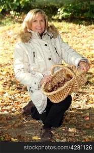 Senior woman picking mushrooms