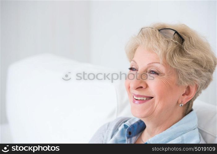 Senior woman portrait, at home with white hair