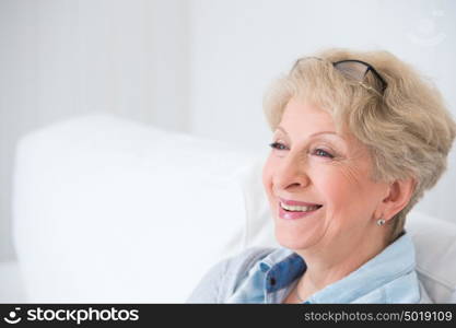 Senior woman portrait, at home with white hair